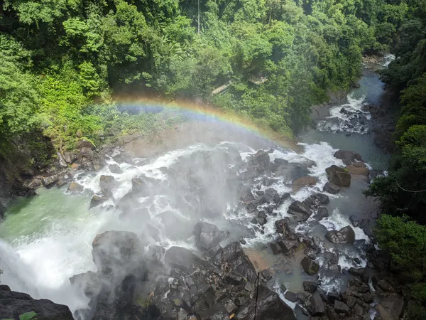Prayer flags above the waterfall in the Diamante Valley